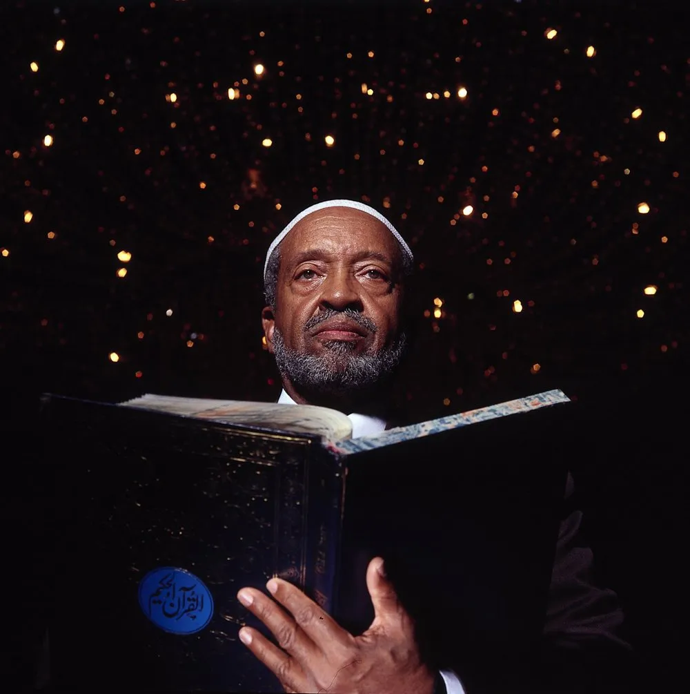 Imam Warith Deen Mohammed holding the Qur’an